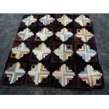 A small log cabin quilt, around early 20th century,using bright silks and velvets amongst other