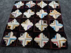 A small log cabin quilt, around early 20th century,using bright silks and velvets amongst other