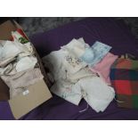 A box full of vintage table linen and similar including embroidered pieces, crotchet work and more.