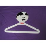 A collectable and iconic late 1960s original Twiggy coat hanger.