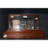 An early 20th century barograph having bevel edged glass and mahogany case with brass fitments