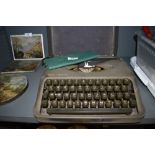 A portable typewriter by Empire The Aristocrat