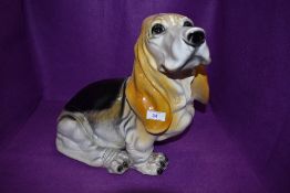 A resin cast figure of a hound dog singed King to base