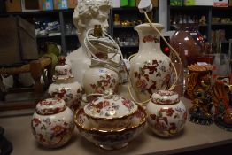 Two Masons 'Mandalay red' lamp bases, two ginger jars, lidded urn, fruit bowl and dish with lid.