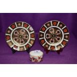 Two plates and small trinket dish by Royal Crown Derby