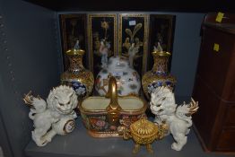 A selection of Chinese and oriental decorations including folding panel and fu dogs