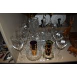 A mixed lot of glass including wine glasses, cut glass ash tray, vases and decanter.
