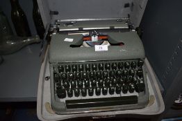 A vintage olive green Olympia typewriter