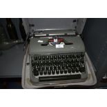 A vintage olive green Olympia typewriter