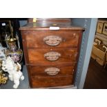 A set of four drawers of small size made in mahogany