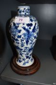 A Chinese export blue and white ware vase having detailed decoration of birds, butterfly and foliage