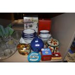 An assortment of vintage enamel bowls and dishes, also including advertising tins and,tea pot and