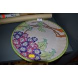 A large Art Deco styled charger plate by Charlotte Rhead depicting tree in bloom signed and