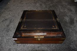A large sized antique writers compendium having brass fitments and compartmental internals