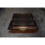 A large sized antique writers compendium having brass fitments and compartmental internals