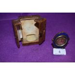 An antique miniature cased travel clock having enamel decoration with brass case working condition