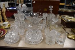 A selection of clear cut and crystal glass wares including water jug and large etched fruit bowl