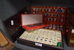 A selection of Chinese games and counters including miniature mask set and boxed Ma Jong