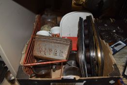 A box full of kitchenalia, including baking trays and loaf tins, also Royal Doulton mugs.