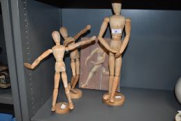 A selection of beech wood artist poseable figures and models