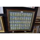 A framed set of Players cigarette cards or cricket interest.