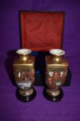 a pair of highly decorated Japanese Satsuma ware vases with 1000 faces design, also having