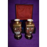a pair of highly decorated Japanese Satsuma ware vases with 1000 faces design, also having