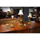 A three lamp set of plaster gilt table lamps