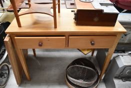 A vintage stripped pine side table/desk, square tapered legs with bite damage, approx 101 x 48cm
