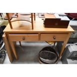 A vintage stripped pine side table/desk, square tapered legs with bite damage, approx 101 x 48cm