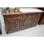 An early 20th Century oak low sideboard/dresser base, with approx. 152cm