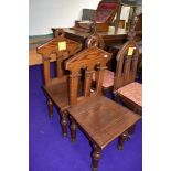 Two ecclesiastical pitch pine communion chairs.