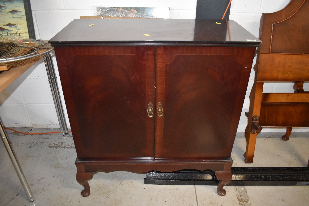 A period style mahogany TV cabinet on cabriole legs, approx width 82cm