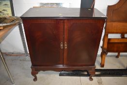 A period style mahogany TV cabinet on cabriole legs, approx width 82cm