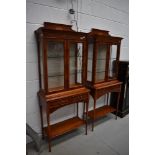 A pair of reproduction yew wood display cabinets, illuminated upper glazed section over double