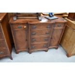 A Reprodux reproduction yew wood breakfront sideboard of small proportions, width approx. 104cm