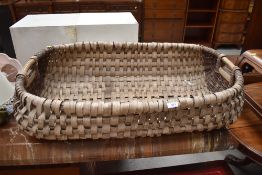 A large vintage moses style basket, possibly for fruit and vegetables or fish, width approx. 97cm