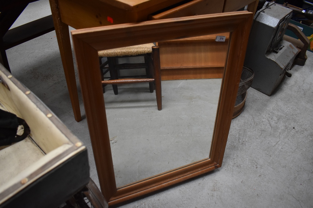 A modern pine wall mirror, approx. 71 x 56cm