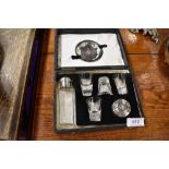 Portable early 20th century cased ecclesiastical communion set, comprising of bottle, glasses and