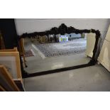 A large hardwood overmantel mirror, foliate decoration with couple of chips off, width approx.150cm