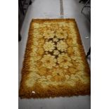 A vintage wool/nylon rug labelled St Michael (Marks & Spencer) , approx. 91 x 152cm