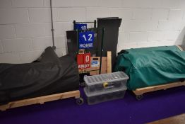 A large selection of indoor bowling equipment, including mats, bowls, score boards etc