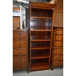 A reproduction yew wood book case, approx 66cm wide, height 185cm