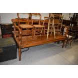 A large hardwood bench with brass and iron fixings , of Indian origin, quite possibly from railways,