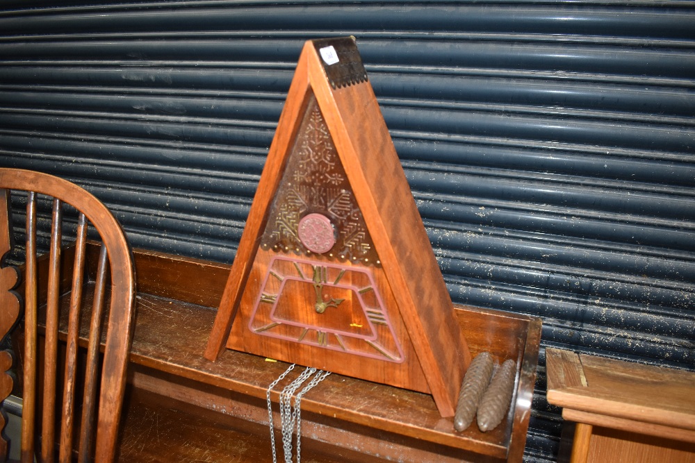 An interesting vintage cuckoo clock, probably Russian, of triangular form , having double pine