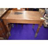 A church vestibule table having traditional shaker design