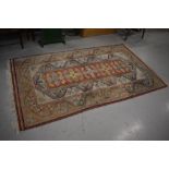 An Oriental style rug, approx 210 x 120cm