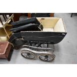 A vintage perambulator pram/push chair