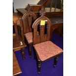 Two ecclesiastical gothic styled oak communion chairs.
