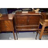 A mid 20th Century mahogany cocktail cabinet on cabriole legs width approx. 77cm, having mirrored